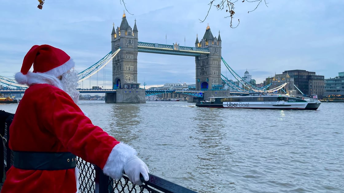 Santa by the Thames overlooking Thames Clipper - Tower Bridge- Landscape